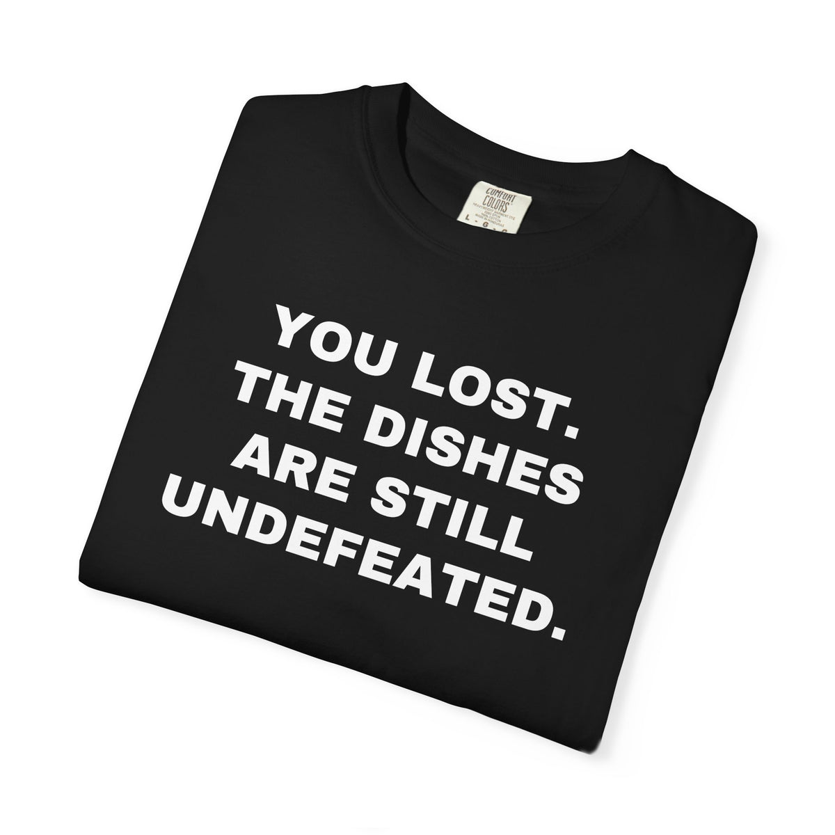 Folded black shirt showing the front rivalry slogan.