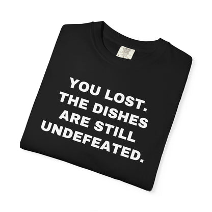 Folded black shirt showing the front rivalry slogan.