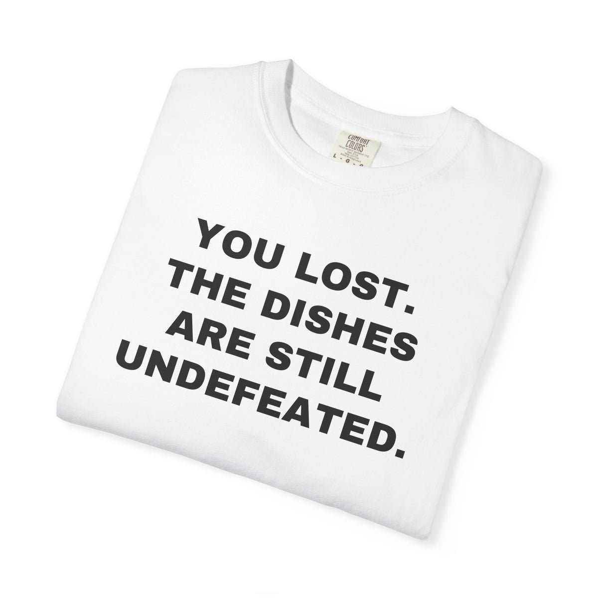 Folded white shirt showing the front rivalry slogan.